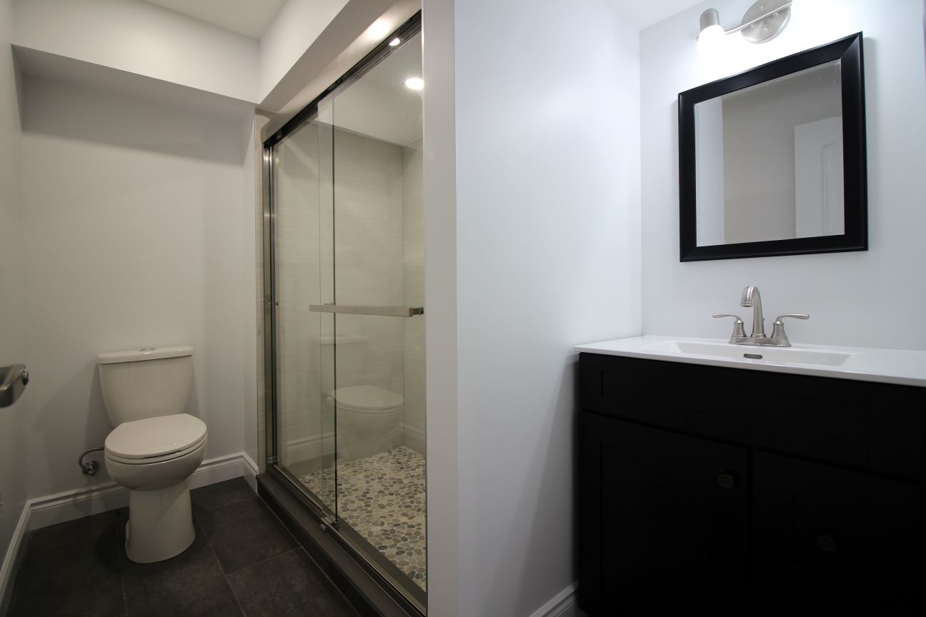 Bathroom renovation London Ontario — walk-in shower with modern tile